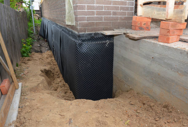 SJ Waterproofing Pros technician performing targeted Sump Pump Installation assessment in Poolesville, MD
